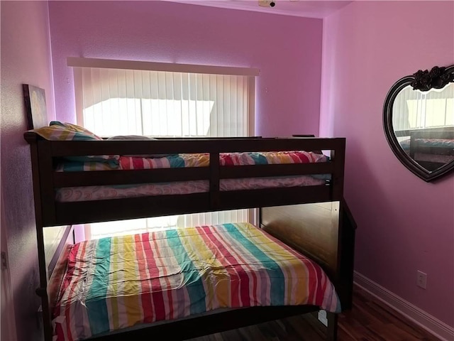 bedroom with hardwood / wood-style floors