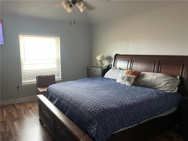 bedroom with dark wood-type flooring and ceiling fan