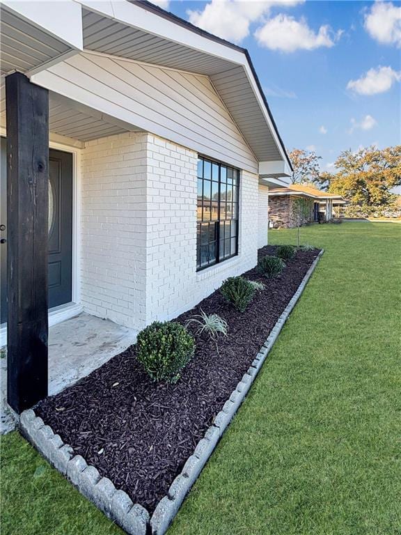 3073 Marydon Dr, Baton Rouge, LA 70814 - view of property exterior with brick siding and a lawn