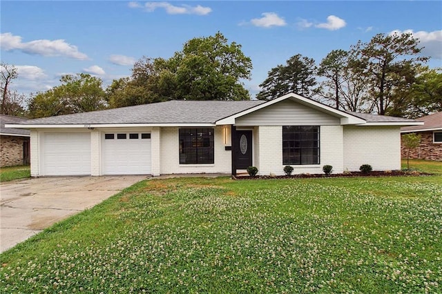 3073 Marydon Dr, Baton Rouge, LA 70814 - ranch-style house with brick siding, driveway, a garage, and a front lawn