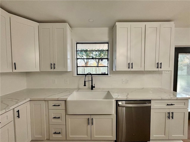 kitchen with sink, plenty of natural light, stainless steel dishwasher, and light stone countertops