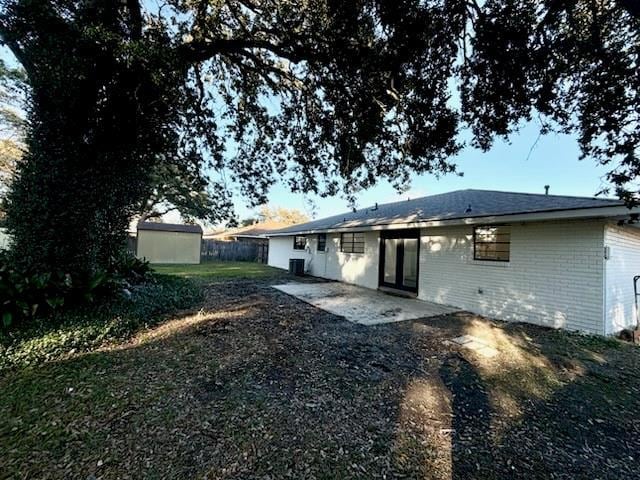 back of house with central AC and a patio