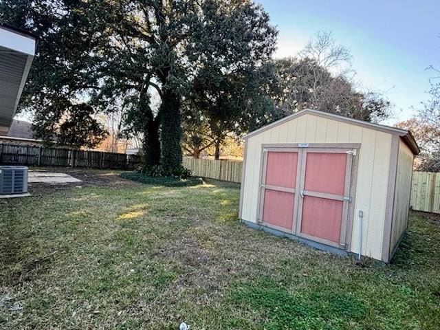 exterior space with a yard and central air condition unit