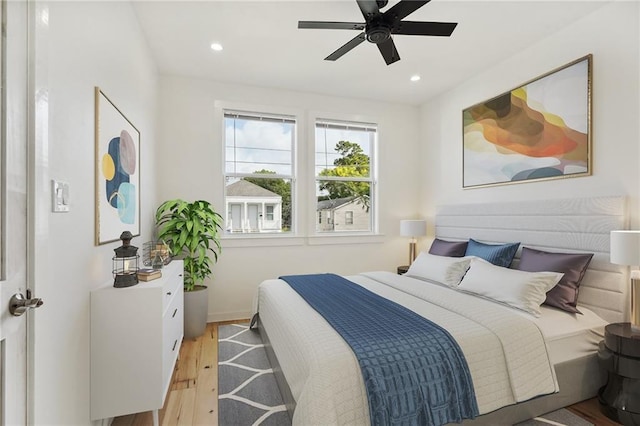 bedroom featuring ceiling fan and light hardwood / wood-style flooring