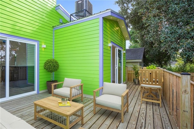 wooden terrace featuring an outdoor hangout area and cooling unit