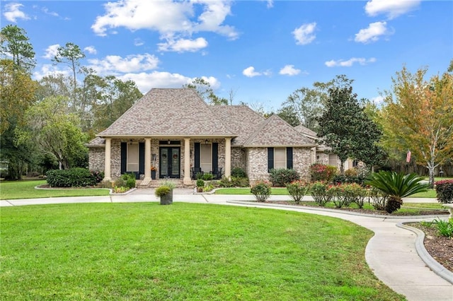 view of front of home featuring a porch and a front yard