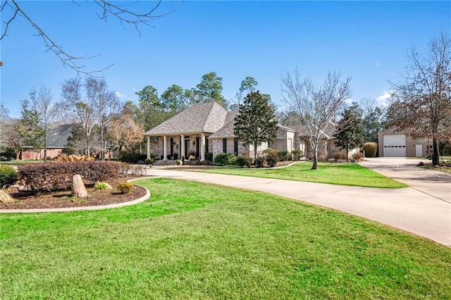 view of front of home featuring a garage and a front lawn