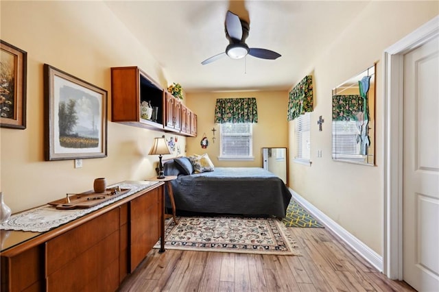 bedroom featuring ceiling fan and light hardwood / wood-style flooring