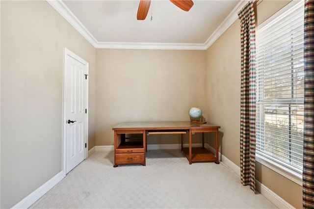 home office with crown molding, ceiling fan, and light carpet