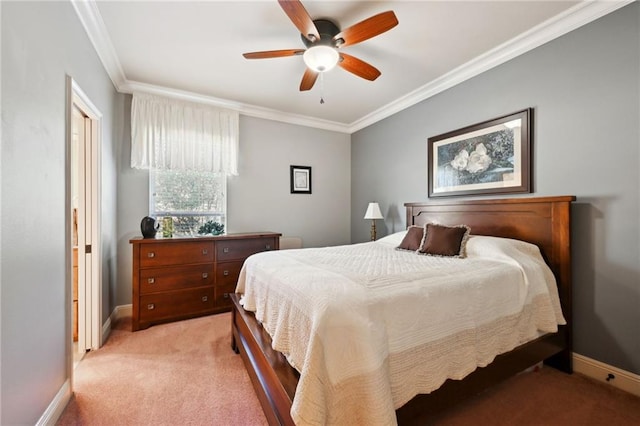 carpeted bedroom with ornamental molding and ceiling fan