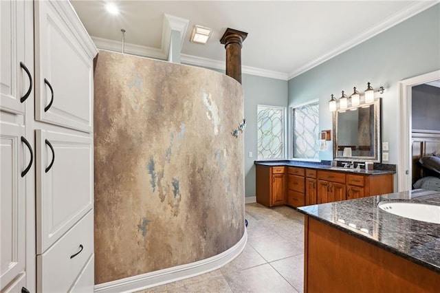 bathroom with crown molding, vanity, and tile patterned flooring