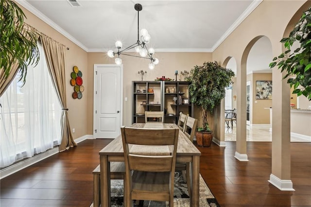 dining area with crown molding, a wealth of natural light, and dark wood-type flooring