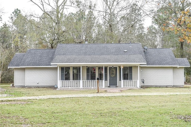 single story home featuring a front yard and covered porch