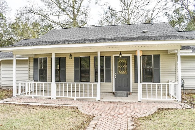 doorway to property with a porch