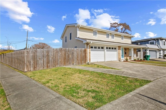 view of property with a garage and a front yard