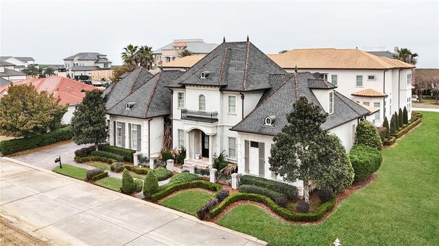 french country home with a garage