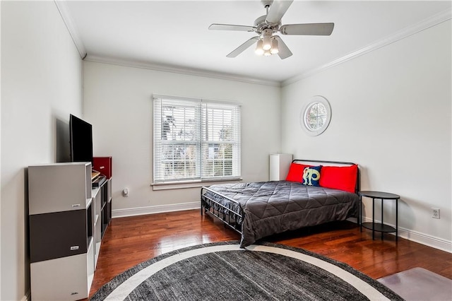 bedroom with crown molding, dark hardwood / wood-style floors, and ceiling fan