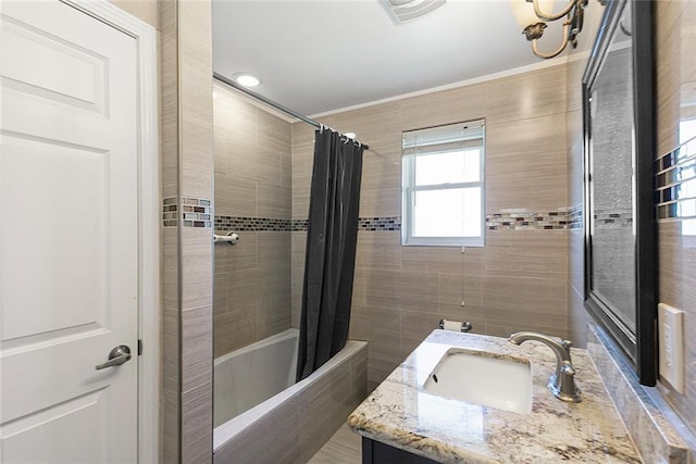 bathroom with ornamental molding, vanity, and shower / bathtub combination with curtain