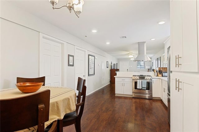 dining area with a notable chandelier and dark hardwood / wood-style flooring