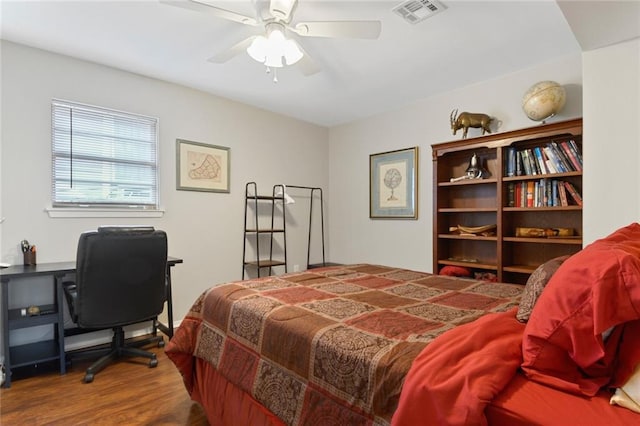 bedroom with hardwood / wood-style flooring