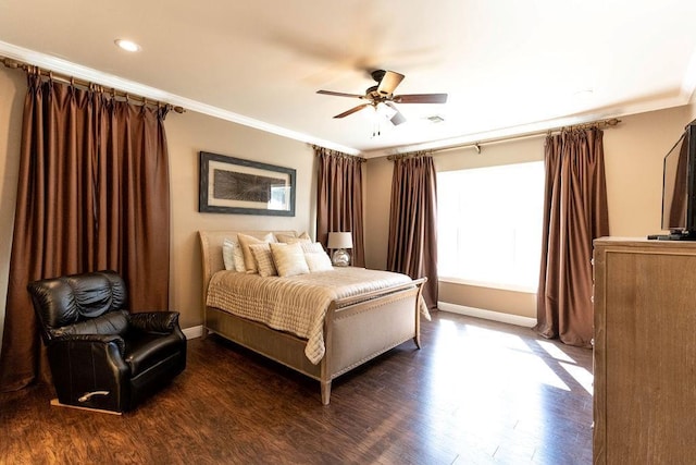 bedroom featuring crown molding, baseboards, and dark wood finished floors