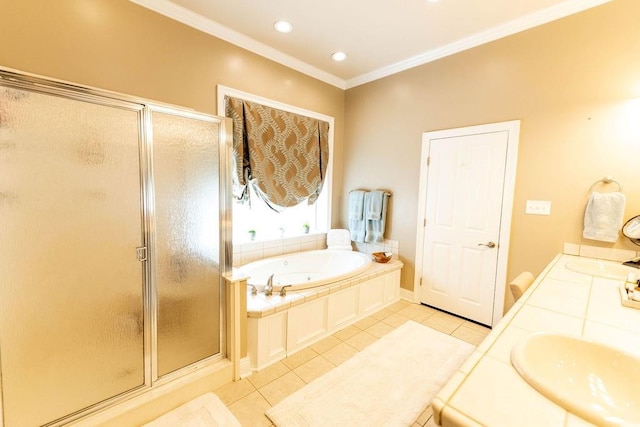 bathroom with ornamental molding, tile patterned floors, independent shower and bath, and vanity