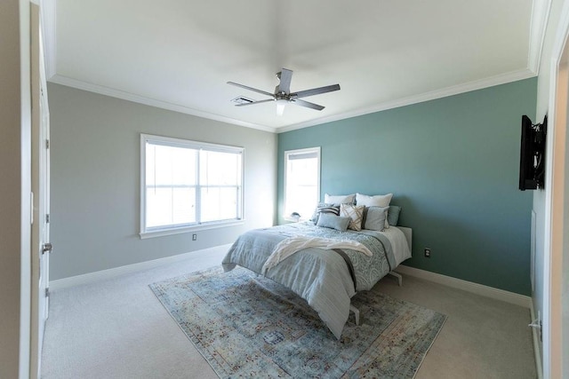 bedroom featuring baseboards, carpet floors, and crown molding