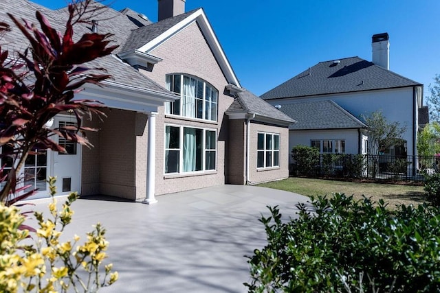 back of house with a patio