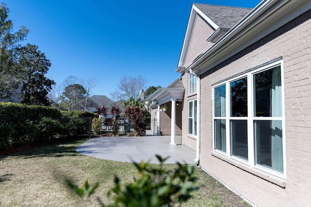 view of yard featuring a patio and fence