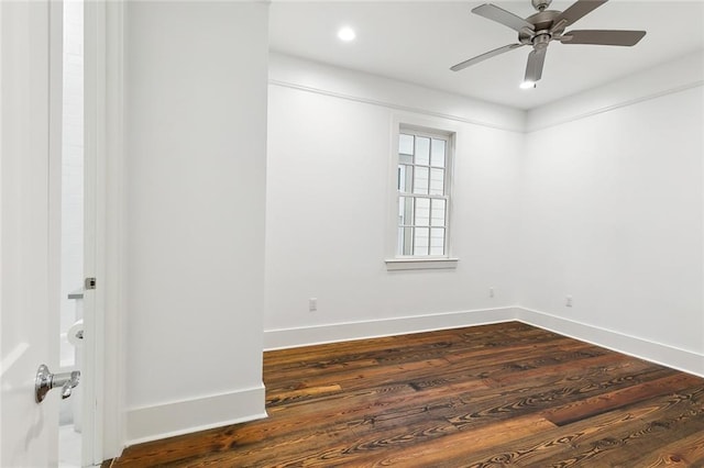 unfurnished room featuring dark hardwood / wood-style floors and ceiling fan