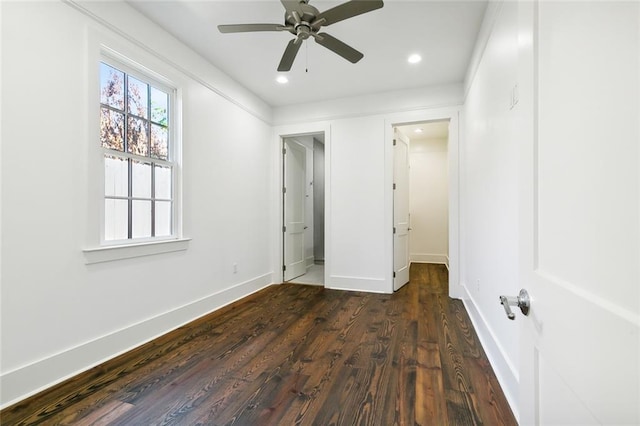 unfurnished bedroom with dark wood-type flooring and ceiling fan