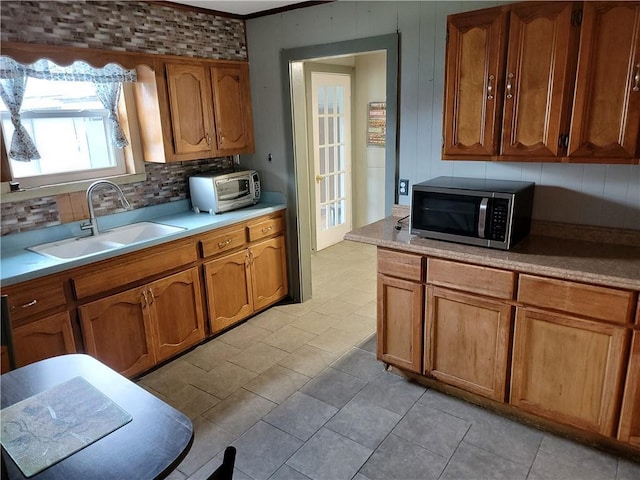 kitchen featuring sink and backsplash