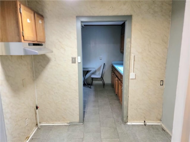 kitchen with light tile patterned flooring