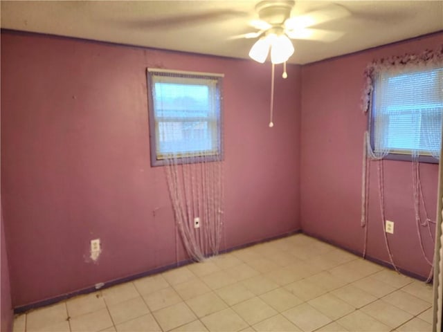 empty room with plenty of natural light and ceiling fan