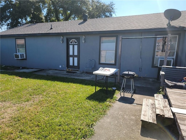 back of house featuring cooling unit, a lawn, and a patio area