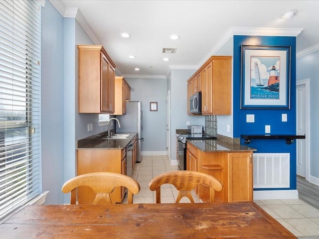 kitchen featuring light tile patterned floors, black range with electric stovetop, visible vents, ornamental molding, and stainless steel microwave