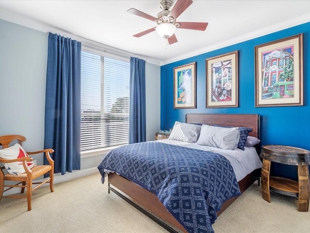 bedroom featuring carpet, ornamental molding, ceiling fan, and baseboards