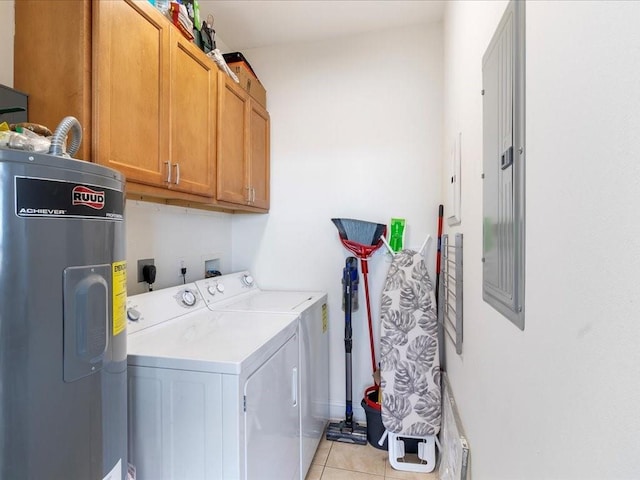 clothes washing area with washer and dryer, cabinet space, light tile patterned flooring, and electric water heater