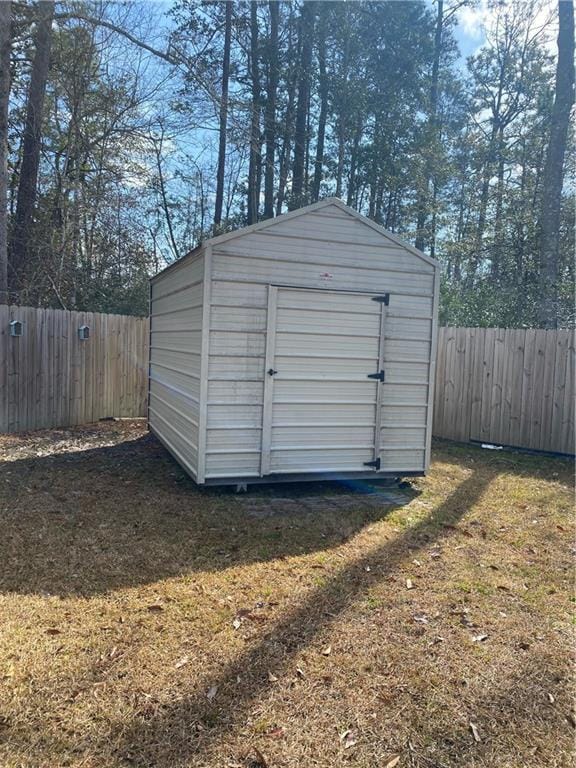 view of outdoor structure with a lawn