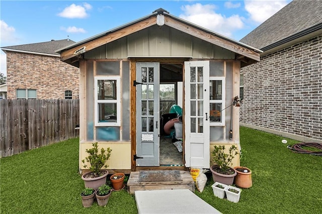 view of outbuilding with a lawn