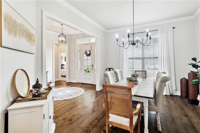 dining room with dark hardwood / wood-style flooring, a wealth of natural light, and ornamental molding