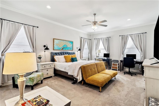 bedroom with ornamental molding and light colored carpet