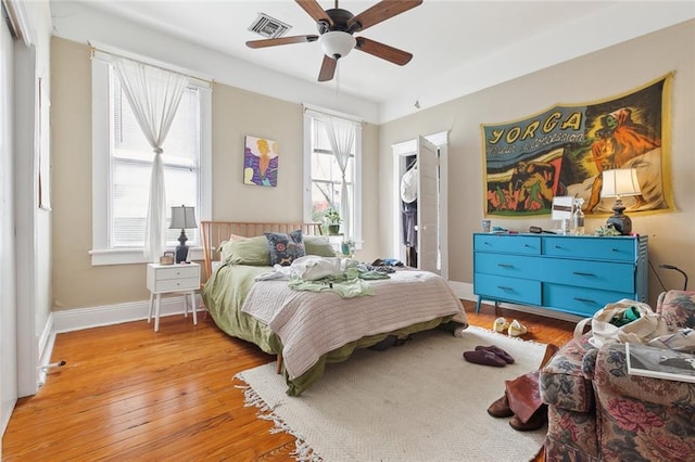 bedroom featuring ceiling fan and light hardwood / wood-style flooring