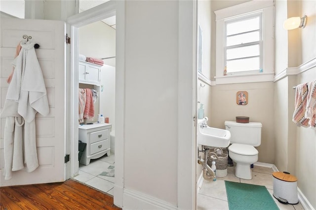 bathroom with sink, tile patterned floors, and toilet