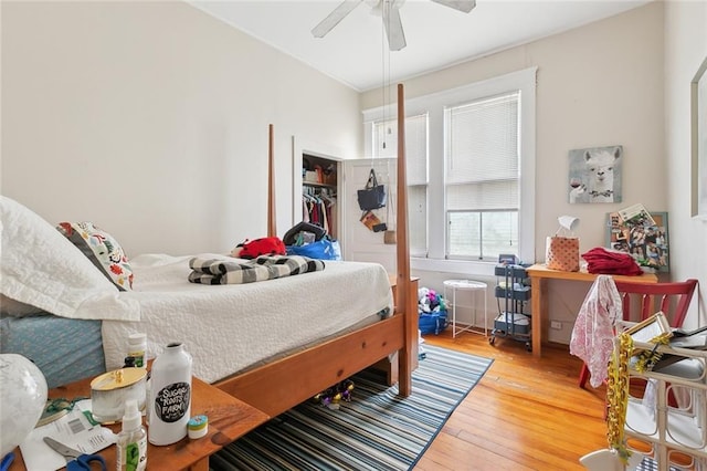 bedroom with ceiling fan and light hardwood / wood-style flooring