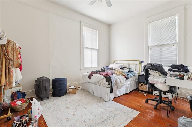 bedroom with hardwood / wood-style floors and ceiling fan