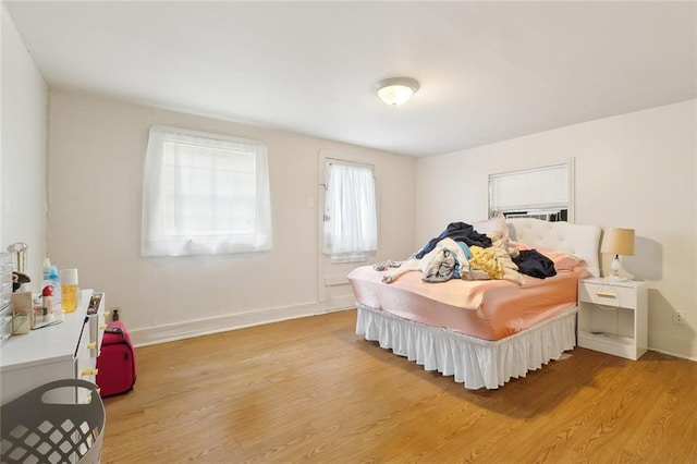 bedroom with light hardwood / wood-style flooring