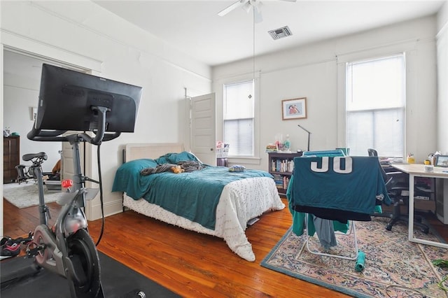 bedroom featuring wood-type flooring and ceiling fan