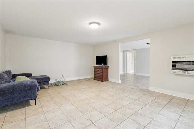 living area featuring heating unit and light tile patterned floors