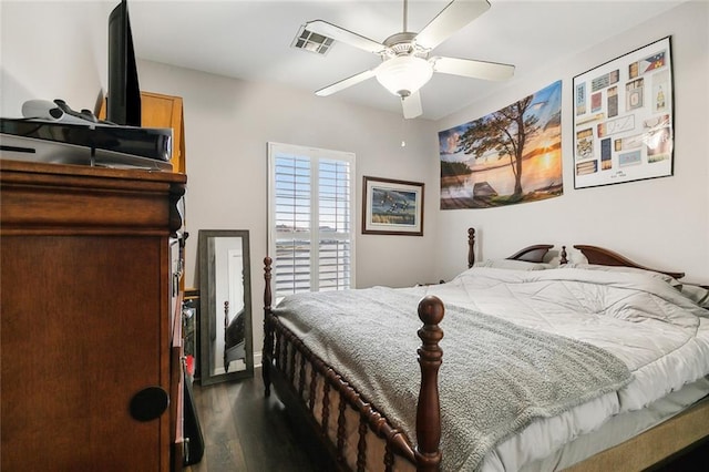 bedroom featuring dark wood-type flooring and ceiling fan